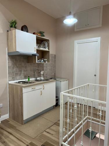 a kitchen with a sink and a counter top at La petite maison in Naples