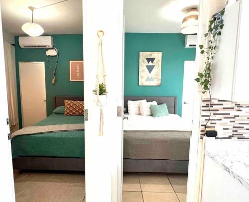 Cama o camas de una habitación en Villa 5 Min From San Juan Airport and Isla Verde Beach Best Location & Pool & Jacuzzi & YOUTUBE VIDEO Available