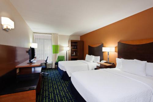 a hotel room with two beds and a desk at Fairfield Mission Viejo Orange County in Mission Viejo