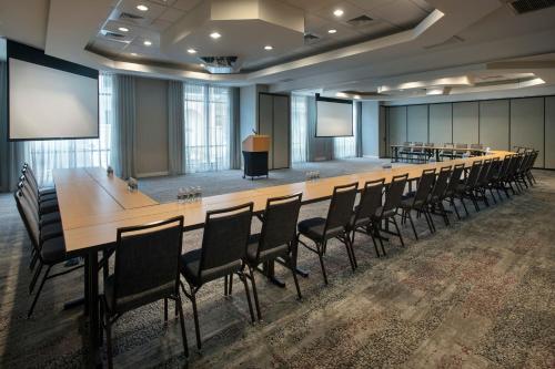 a large conference room with a long table and chairs at Courtyard by Marriott Gaithersburg Washingtonian Center in Gaithersburg