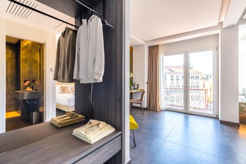 a room with a bedroom and a bed and a window at Dei Martiri Suite in Naples
