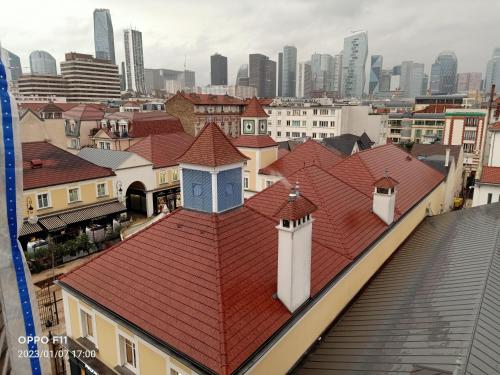 a group of buildings with red roofs in a city at Paris La Défense in Puteaux