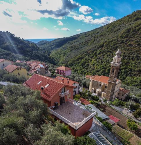an aerial view of a small town with a clock tower at Agriturismo La Rocca in San Bartolomeo al Mare