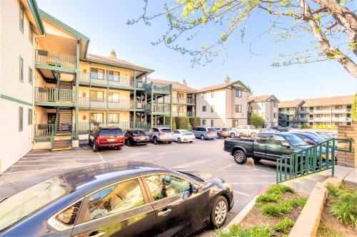 a parking lot with cars parked in front of buildings at Lagonita Lodge in Big Bear Lake