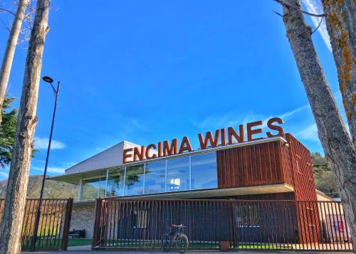 a building with a sign that reads emirina wines at BenedettaMolinaseca VuT in Molinaseca