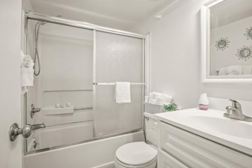 a bathroom with a shower and a toilet and a sink at The Palace Resort Unit 2310 in Myrtle Beach
