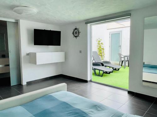 Televisyen dan/atau pusat hiburan di Estudio Grey by Vulcano Homes