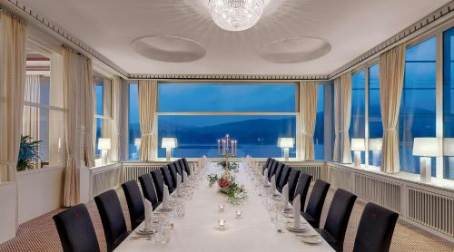 a long dining room with a long table and chairs at Rheinhotel Dreesen in Bonn