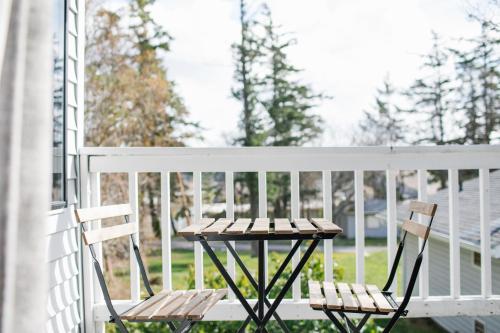 a table and two chairs on a porch at Friday Harbor Suites in Friday Harbor