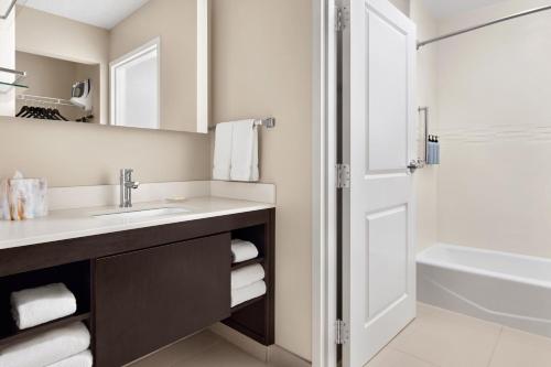 a bathroom with a sink and a shower at Residence Inn by Marriott Harrisburg Carlisle in Carlisle