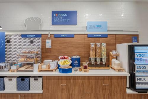 a grocery store counter with food on a shelf at Holiday Inn Express Troy by IHG in Troy