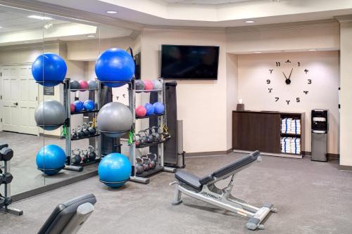 a gym with blue balls and weights and a clock at Residence Inn Columbia Northeast/Fort Jackson Area in Columbia