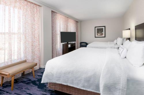a hotel room with a large white bed and a window at Fairfield Inn & Suites by Marriott Atlanta Downtown in Atlanta
