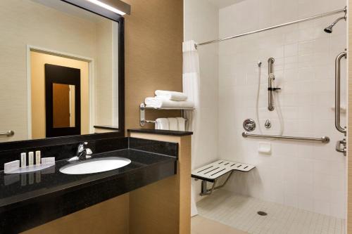 a bathroom with a sink and a shower at Fairfield Inn & Suites by Marriott Toledo Maumee in Maumee