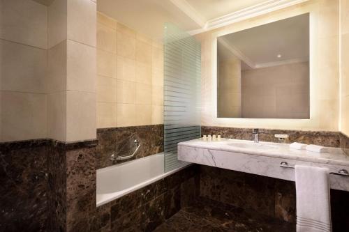 a bathroom with a sink and a mirror at Sheraton Riyadh Hotel & Towers in Riyadh