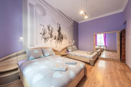 Posteľ alebo postele v izbe v ubytovaní Queen Apartments