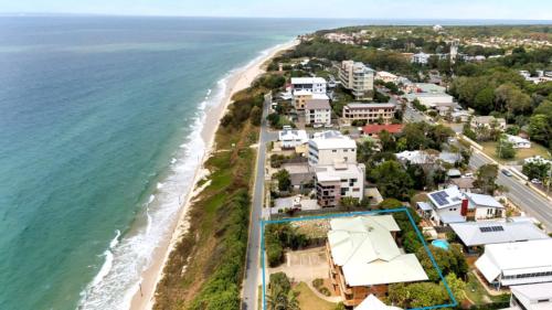 an aerial view of a beach with houses at Beachside Woorim Weekender in Woorim