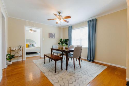 a dining room with a table and a ceiling fan at Centrally Located 3BR Overton Square Fast WiFi Free Parking Yes Pets in Memphis