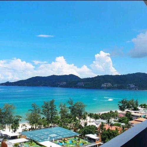 a view of the ocean from a balcony of a resort at Patong Tower Ocean View Apartment in Patong Beach