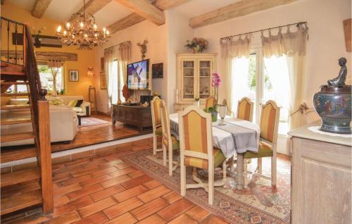 a kitchen and dining room with a table and chairs at Nice Home In Orgon With Private Swimming Pool, Can Be Inside Or Outside in Orgon