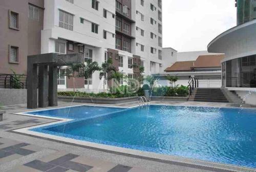 a large blue swimming pool in front of a building at Duplex Axis Condo @Ampang nearby KLCC. in Ampang