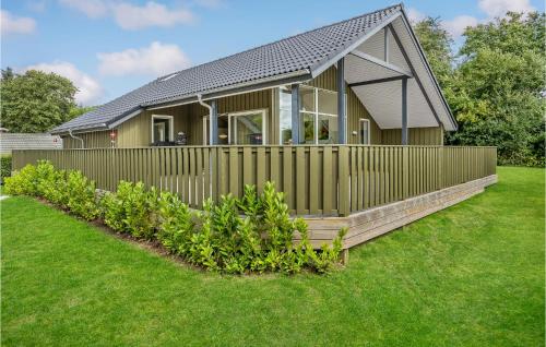 a house with a fence in the yard at 3 Bedroom Beautiful Home In Hejls in Hejls