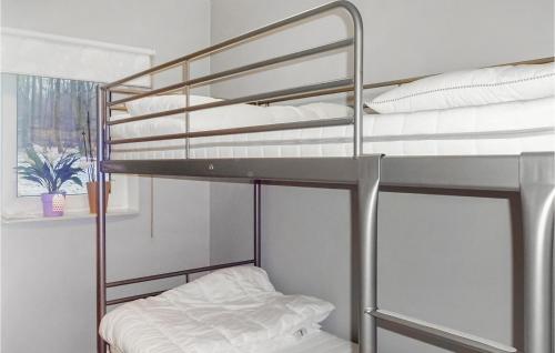 a bunk bed in a room with a bunk bedutenewayangering at Amazing Home In Kvidinge With 2 Bedrooms And Wifi in Kvidinge