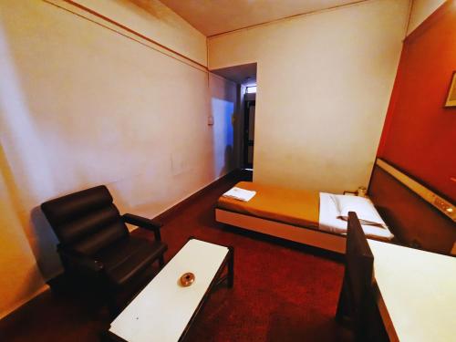 Postel nebo postele na pokoji v ubytování Sanman Deluxe Lodge