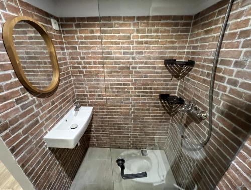a bathroom with a sink and a mirror at Choska Residence in Jakarta