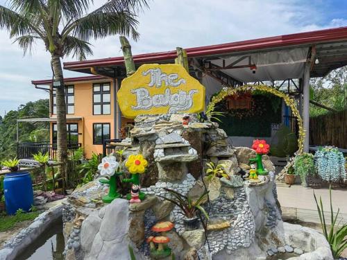 a restaurant with a rock garden in front of a building at THE BALAY MOUNTAIN PEAK in Tanay