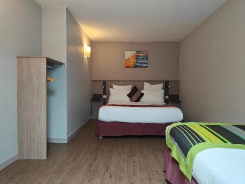 Ένα ή περισσότερα κρεβάτια σε δωμάτιο στο Adagio Access Lyon Centre Université