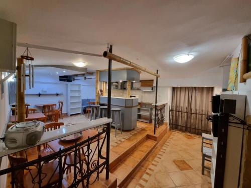a kitchen and dining room with a kitchen and a dining table at Centrum Wellness Hostel in Debrecen