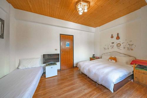 Postel nebo postele na pokoji v ubytování Shan Shui B&B