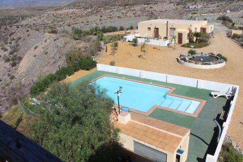 an aerial view of a house with a swimming pool at Oasis Montana peace in Tabernas Desert in Tabernas