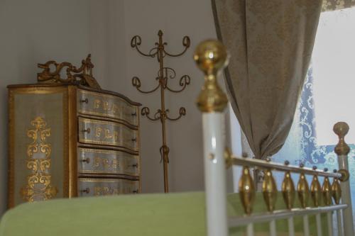 a bedroom with a bed and a dresser and a curtain at Schloss Süßenstein in Hüttenberg