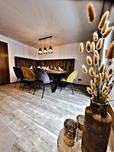 a dining room with a table and chairs at Lebensquelle Krapfenhof in Finkenberg