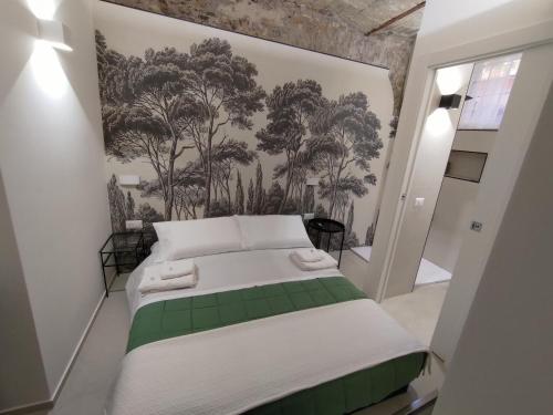 Ein Bett oder Betten in einem Zimmer der Unterkunft A CASA DEI ROMANI