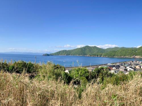 a view of a body of water with a harbor at 柏島ヴィレッジ in Otsuki