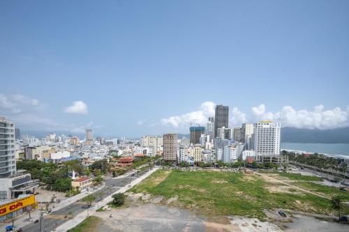 a view of a city with a park in the foreground at Royal Family Hotel in Da Nang