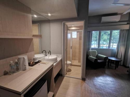 a bathroom with a sink and a toilet and a shower at Reka Hotel Genting Highlands in Genting Highlands