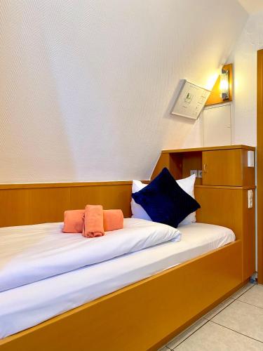 Postel nebo postele na pokoji v ubytování M-Hotel