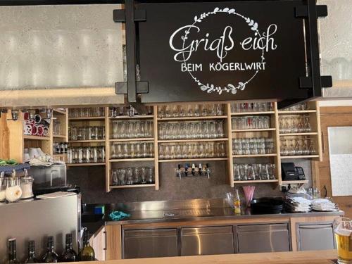 a chalkboard sign above a counter in a restaurant at Gasthof Kögerlwirt in Göstling an der Ybbs