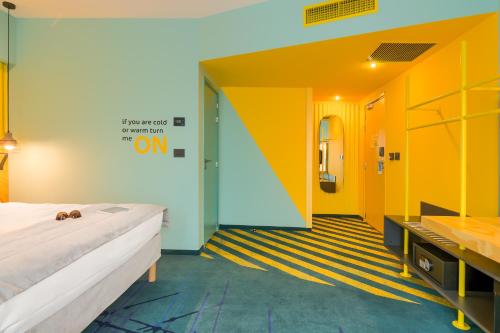 Cama o camas de una habitación en ibis Styles Bucharest Erbas