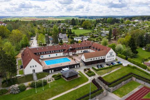 an aerial view of a large house with a swimming pool at Sportschule Werdau in Werdau