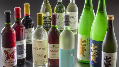 a group of wine bottles sitting next to each other at Shimobe Hotel in Minobu