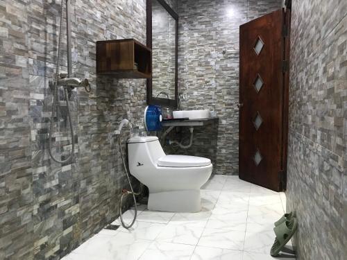 a bathroom with a shower and a toilet in it at Xayana Home Villas in Luang Prabang