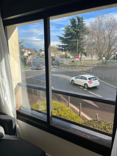 a view from a window of a car on a street at Grand appartement lumineux in Noisy-le-Grand