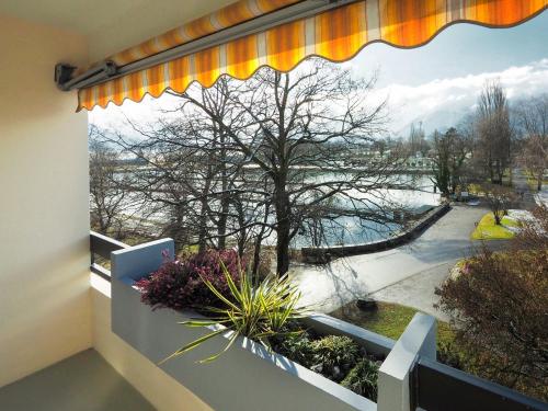 a large window with a view of a river at Hotel Holiday Thun in Thun