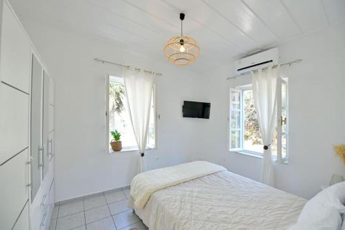 Ένα ή περισσότερα κρεβάτια σε δωμάτιο στο Olivo II Luxury Apartment