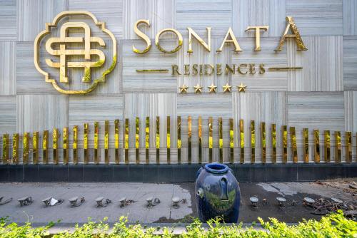 a building with a vase in front of a store at Cozrum Homes - Sonata Residence in Ho Chi Minh City